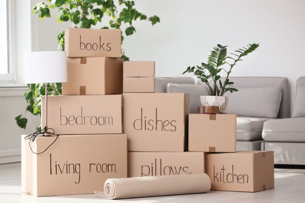 Pile of moving boxes with labels on them