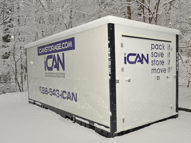 This shows what an iCan portable storage container looks like in the snow, protecting items inside.