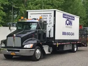 iCan portable storage container loaded on a truck that uses the iBot small spaces delivery system